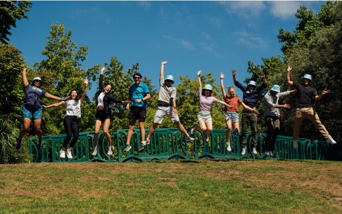 Group of Brooks employees holding a sign saying "Global Running Day"