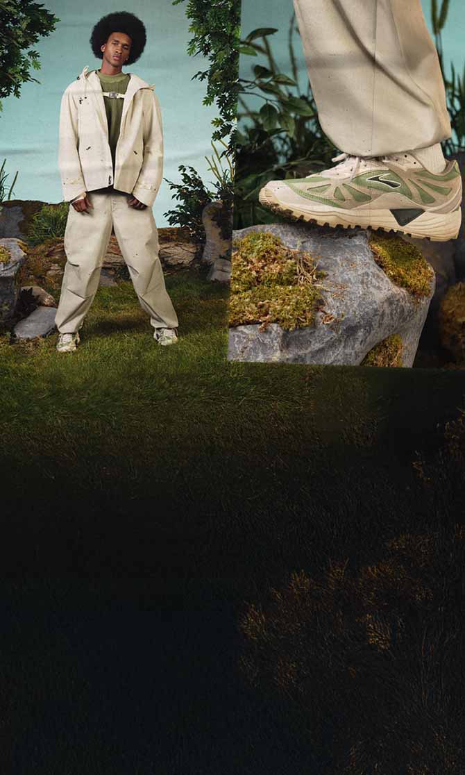 A person poses against a natural background wearing Brooks lifestyle shoes