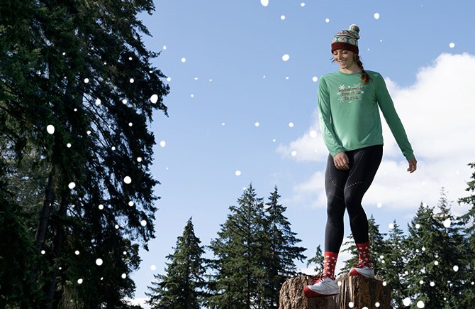 Woman dressed in holiday-themed gear in the forest