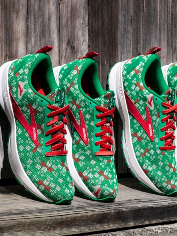 Green and red Brooks shoes lined up