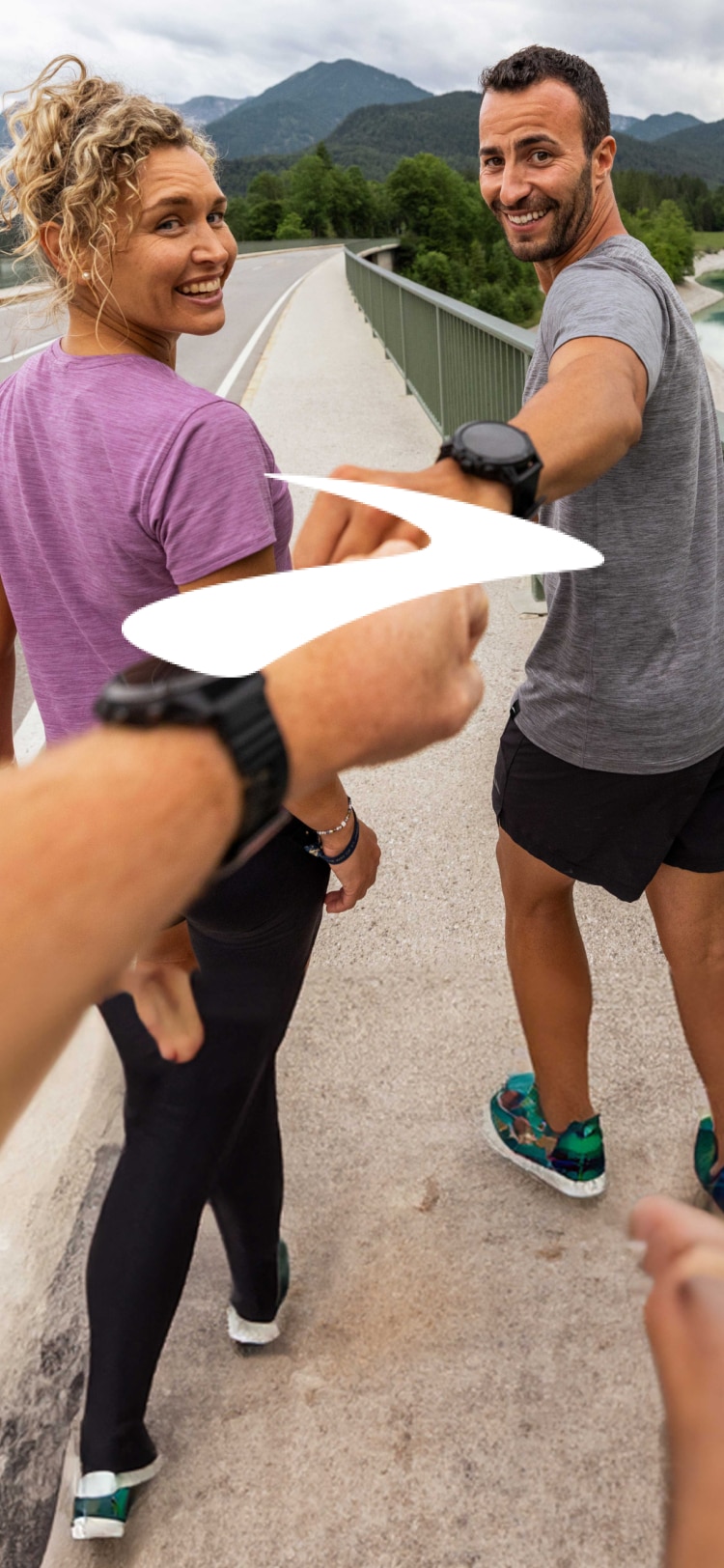 Runners celebrating the run with a fist bump