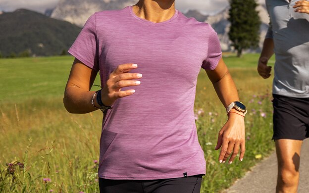 Close-up shot of a woman wearing the Luxe top from Brooks Running