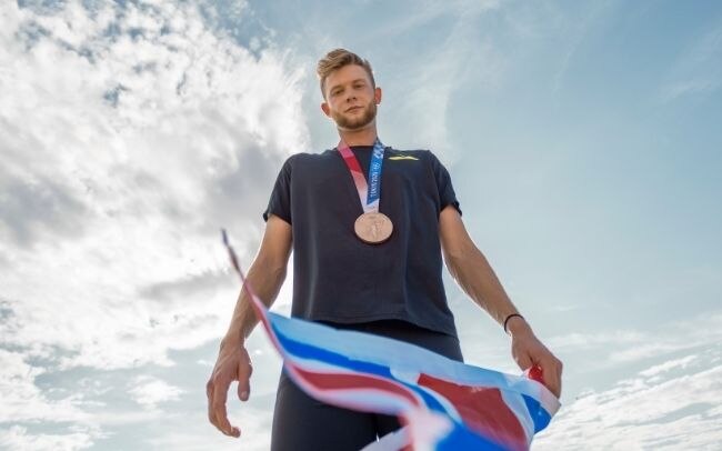 Josh Kerr with his Olympic medal