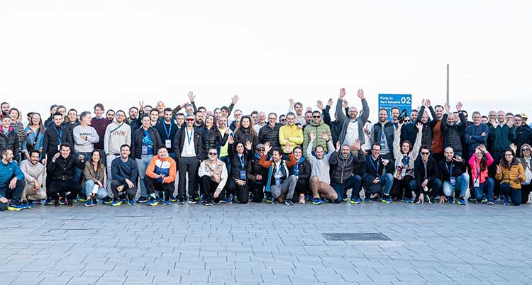 A group of people smiling outside