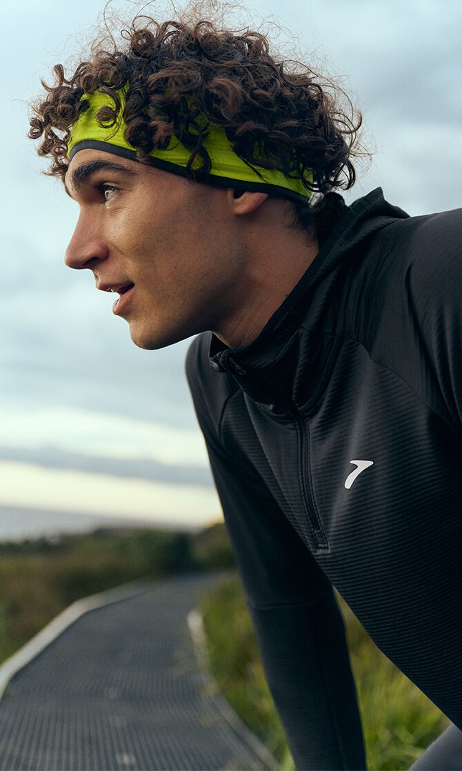 Profile shot of a runner wearing Brooks clothing