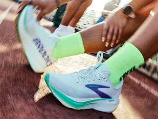 A close-up of a woman wearing Brooks shoes