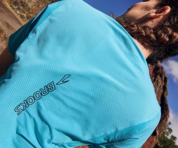 A person wearing women's Brooks apparel