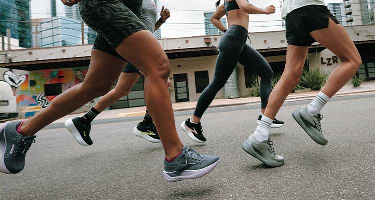 Close-up of runners’ feet in stride