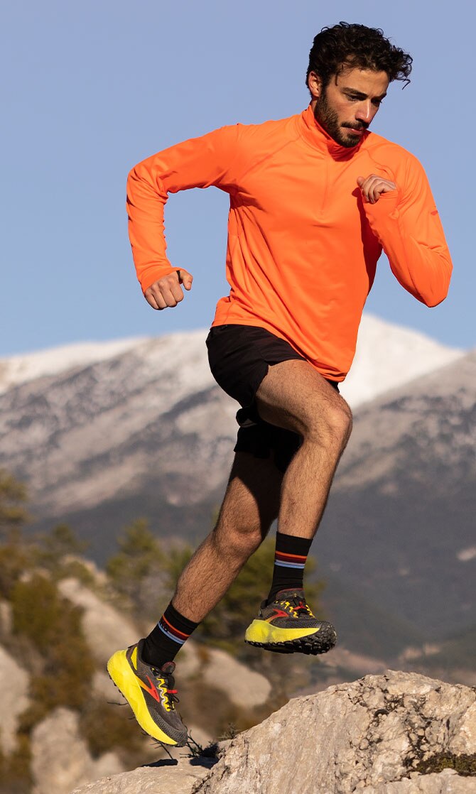 Model with Dash top running on a mountain