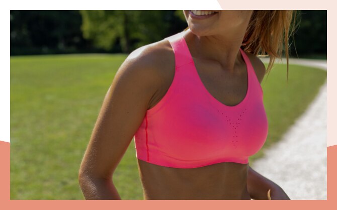 A close up of a woman in a Dare Crossback Run Bra