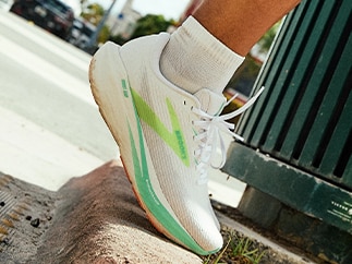 A close-up of a man wearing Brooks shoes
