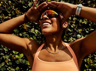 A woman in the sun looks to the side