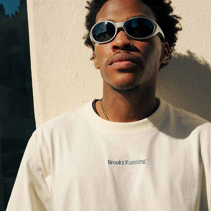 A man in sunglasses wearing the Movement Heavyweight Tee.