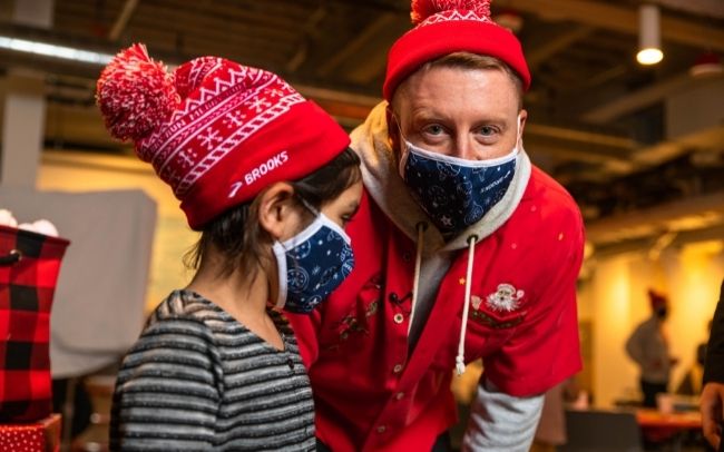 Macklemore and child with holiday hats
