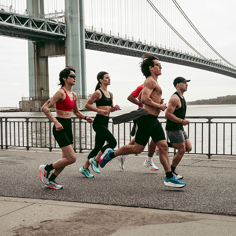 Medium shot of a group of runners racing