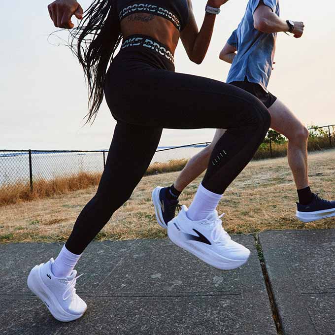 A woman running outside wearing the PR Elite Tight.