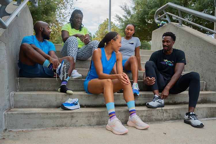Runners sitting on stairs