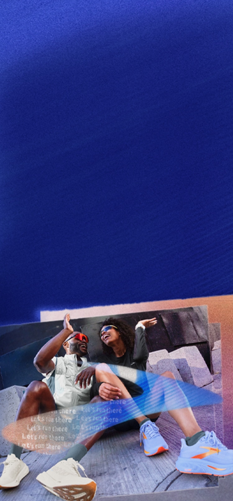 Two people wearing sunglasses, sitting down and smiling.