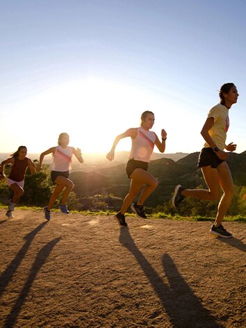 Runners on dirt road