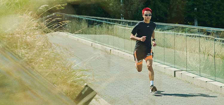 A person running on a pavement.