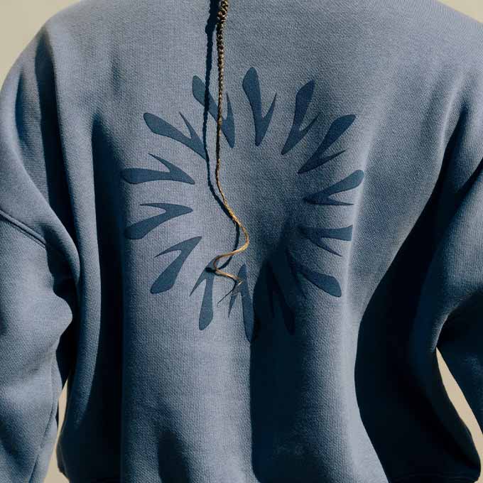The back of the Movement Cropped Sweatshirt in Steel Blue
