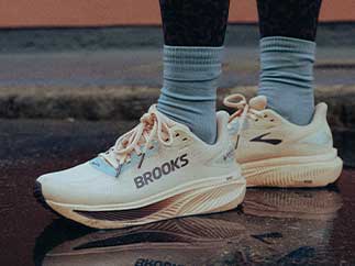 A closeup of a woman wearing Brooks shoes