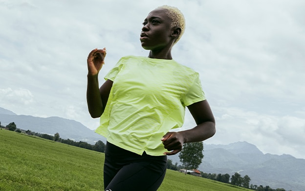 Angle shot of a woman wearing Brooks Running Short Sleeve Top