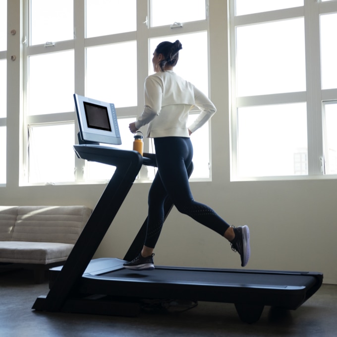 Model with Brooks gear running on treadmill