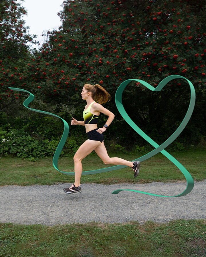 Side view of runner with green heart