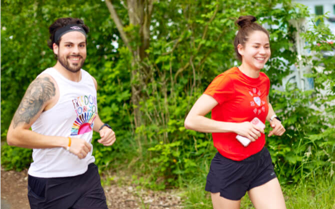 Man and women running outside