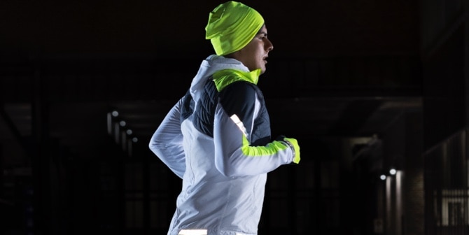 A man running in reflective gear